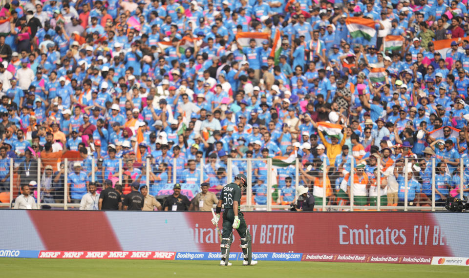 Pakistan's captain Babar Azam leaves the ground after losing his wicket during the ICC Men's Cricket World Cup match between India and Pakistan in Ahmedabad, India, Saturday, Oct. 14, 2023. (AP Photo/Aijaz Rahi)