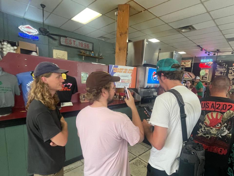 interior shot of people lined up at joe's barbecue chain in Kansas city