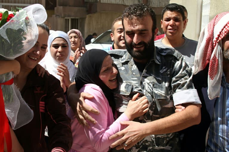 Lebanese police officer Saleh al-Baradei, kidnapped in Arsal by Syria's then Al-Qaeda affiliate Al-Nusra Front, celebrates his release on August 31, 2014