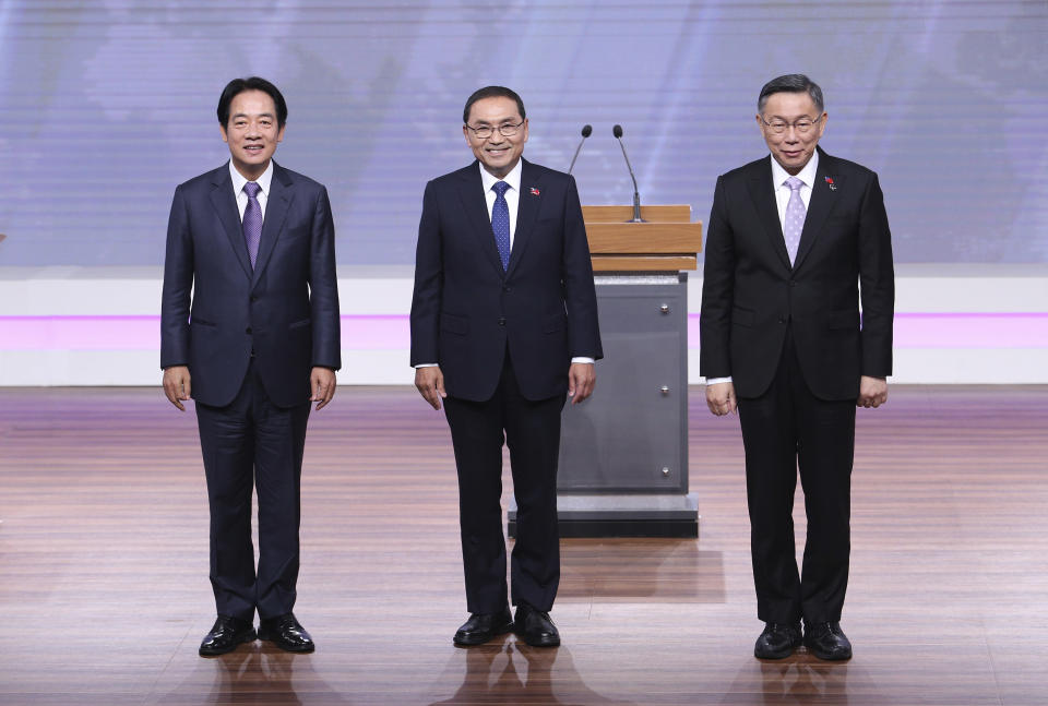 Taiwan President and Democratic Progressive Party presidential candidate William Lai, from left, Taiwan's Nationalist Party presidential candidate Hou Yu-ih and Taiwan's Taiwan People's Party (TPP) presidential candidate Ko Wen-je pose before the presidential debates at Taiwan Public Television Service in Taipei, Taiwan, Saturday, Dec. 30, 2023. Taiwan will hold its presidential election on Jan. 13, 2024. (AP Photo/Pei Chen, Pool)