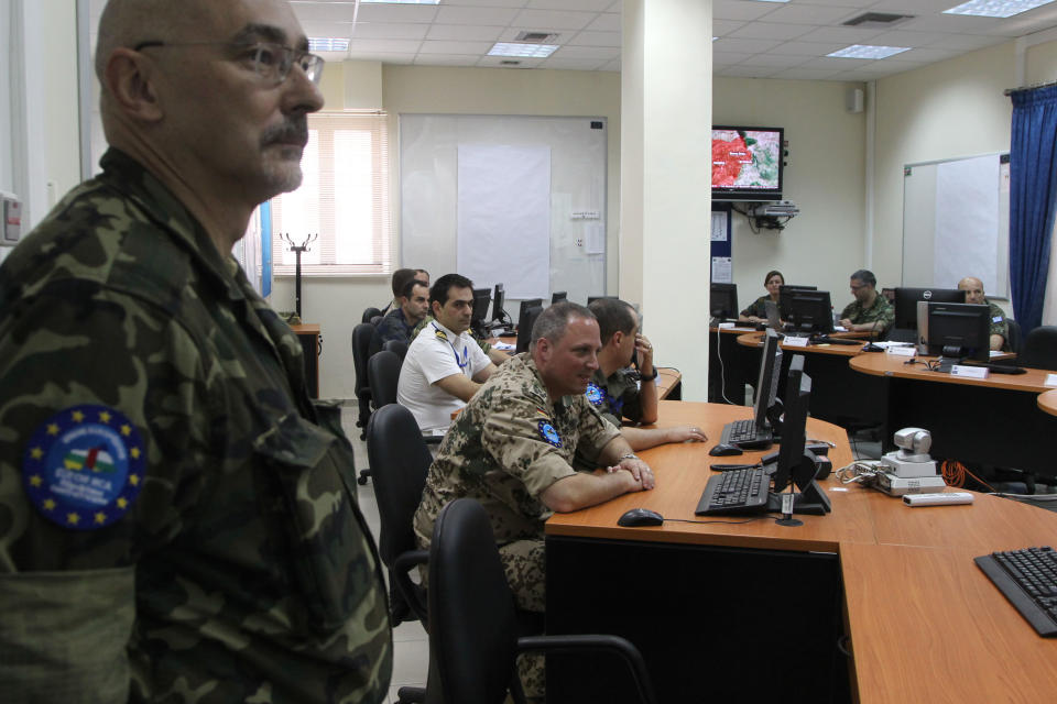 Officers attend in operation room during a presentation of the operation headquarters of the European Union’s force for the Central African Republic, in the central Greek town of Larissa, Tuesday, May, 13, 2014. The force recently began deploying in the African country’s capital, and currently has 235 troops, mainly securing the airport. It expects to have more than 800 troops on the ground by mid-June for a six-month deployment. The Central African Republic has been wracked by sectarian bloodshed for months, leaving thousands dead and forcing nearly 1 million people to flee their homes.(AP Photos/Nikolas Giakoumidis)