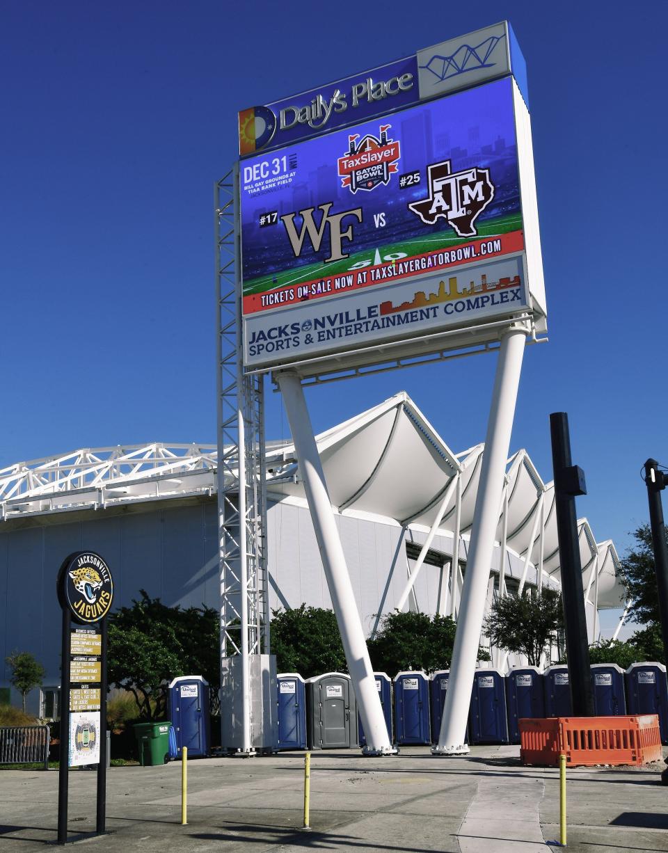 The sign outside Daily's Place and TIAA Bank Field in  Jacksonville, FL Wednesday still shows tickets for sale for the upcoming TaxSlayer Gator Bowl football game on December 31, 2021. Wednesday, December 22, 2021, Texas A&M announced that they would not be participating in the matchup with Wake Forest because of an outbreak of coronavirus infections among the staff and players. [Bob Self/Florida Times-Union]