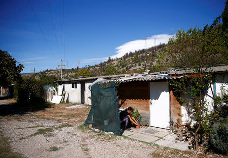 An internally displaced person works at a reception center where IDPs live, in the village of Tasovcici near Capljina, Bosnia and Herzegovina, September 27, 2018. REUTERS/Dado Ruvic