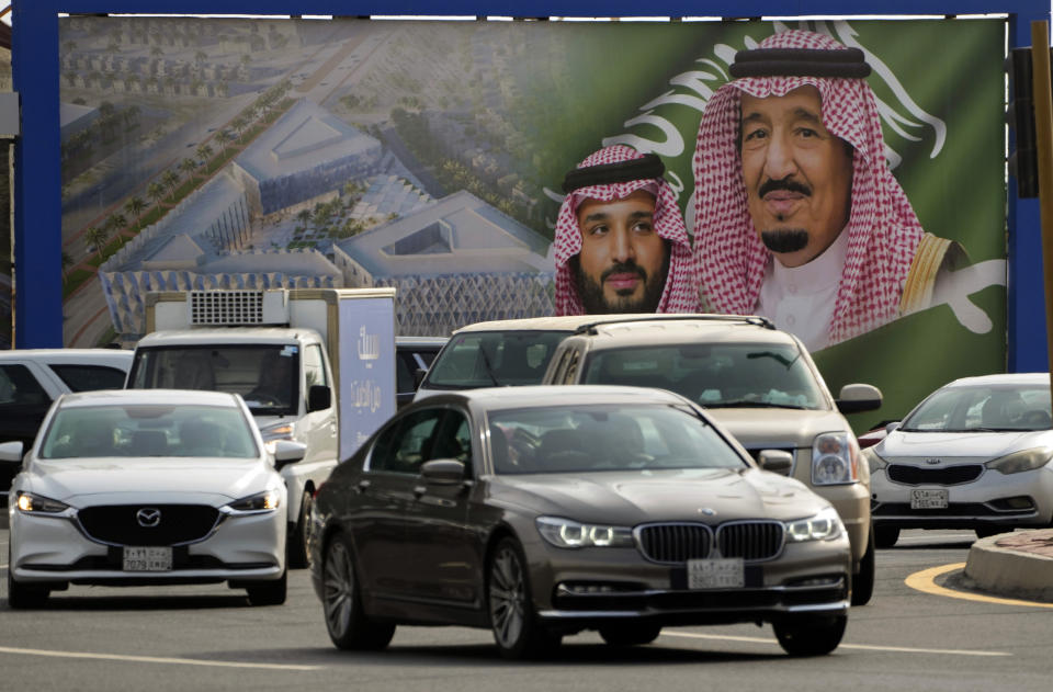 A giant banner showing Saudi King Salman, right, and Crown Prince Mohammed bin Salman, is displayed prior to a visit by U. S. President Joe Biden, in a square in Jeddah, Saudi Arabia, Thursday, July 14, 2022. (AP Photo/Amr Nabil)