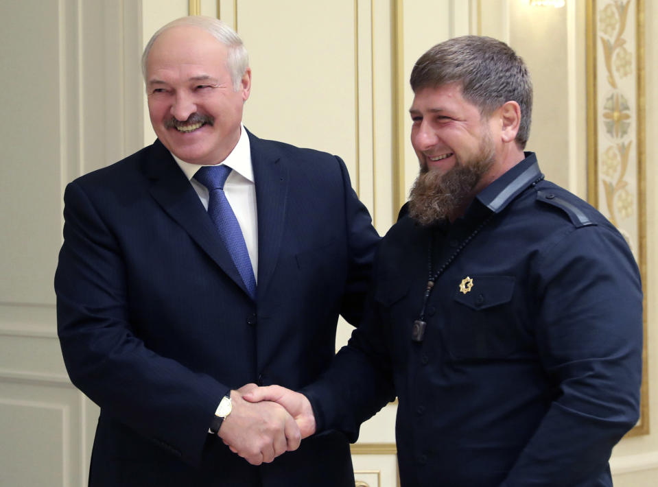 FILE - Belarusian President Alexander Lukashenko, left, and Chechen regional leader Ramzan Kadyrov shake hands during their meeting in Minsk, Belarus, Monday, Sept. 25, 2017. Lukashenko this week once again accused Ukraine of planning to attack it and announced creating a joint grouping of troops with Moscow, a move that stocked fears that Belarusian army could join Russian forces in Ukrainian trenches. (Nikolai Petrov/Pool Photo via AP, File)