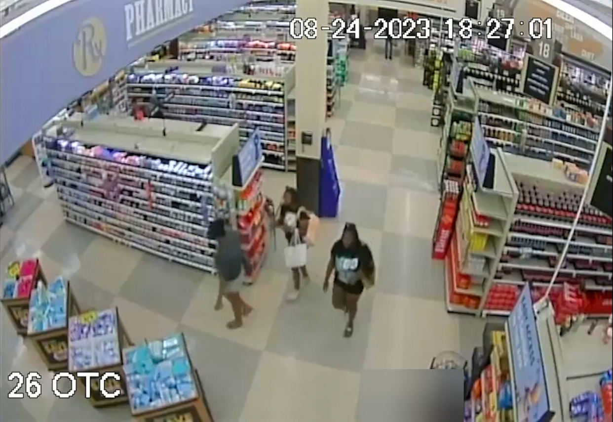 Ta'Kiya Young, right, is seen walking through the Blendon Township Kroger with two other women on August 24.