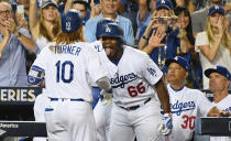 <p>Los Angeles Dodgers third baseman Justin Turner (10) celebrates after hitting a two run home run with right fielder Yasiel Puig (66) in the sixth inning against the Houston Astros in game one of the 2017 World Series at Dodger Stadium. Mandatory Credit: Richard Mackson-USA TODAY Sports </p>