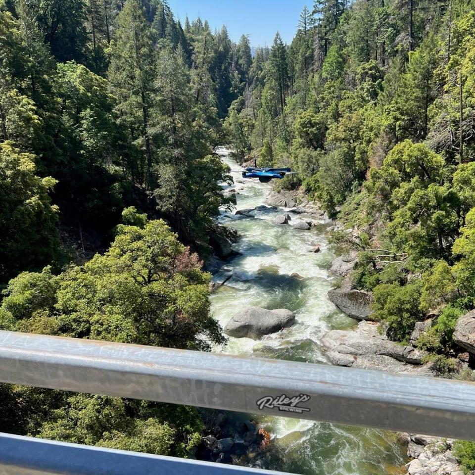 A drone, at center of image, is used to search for one of two women who died after being swept down Tuolumne County Rivers in the past week.