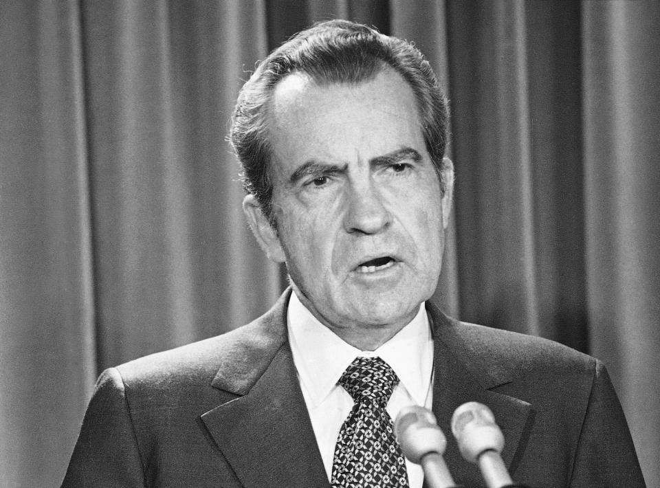 FILE - In this April 17, 1973 file photo, President Richard Nixon speaks during White House news briefing in Washington. Comparisons to the Nixon-era “Saturday night massacre” were swift after President Donald Trump fired the acting attorney general for refusing to enforce his executive order on immigrants and refugees. In both cases, a dispute between a president and his Justice Department led to an evening maneuver by the president to install an acting attorney general more to his liking. (AP Photo/Henry Burroughs. File)