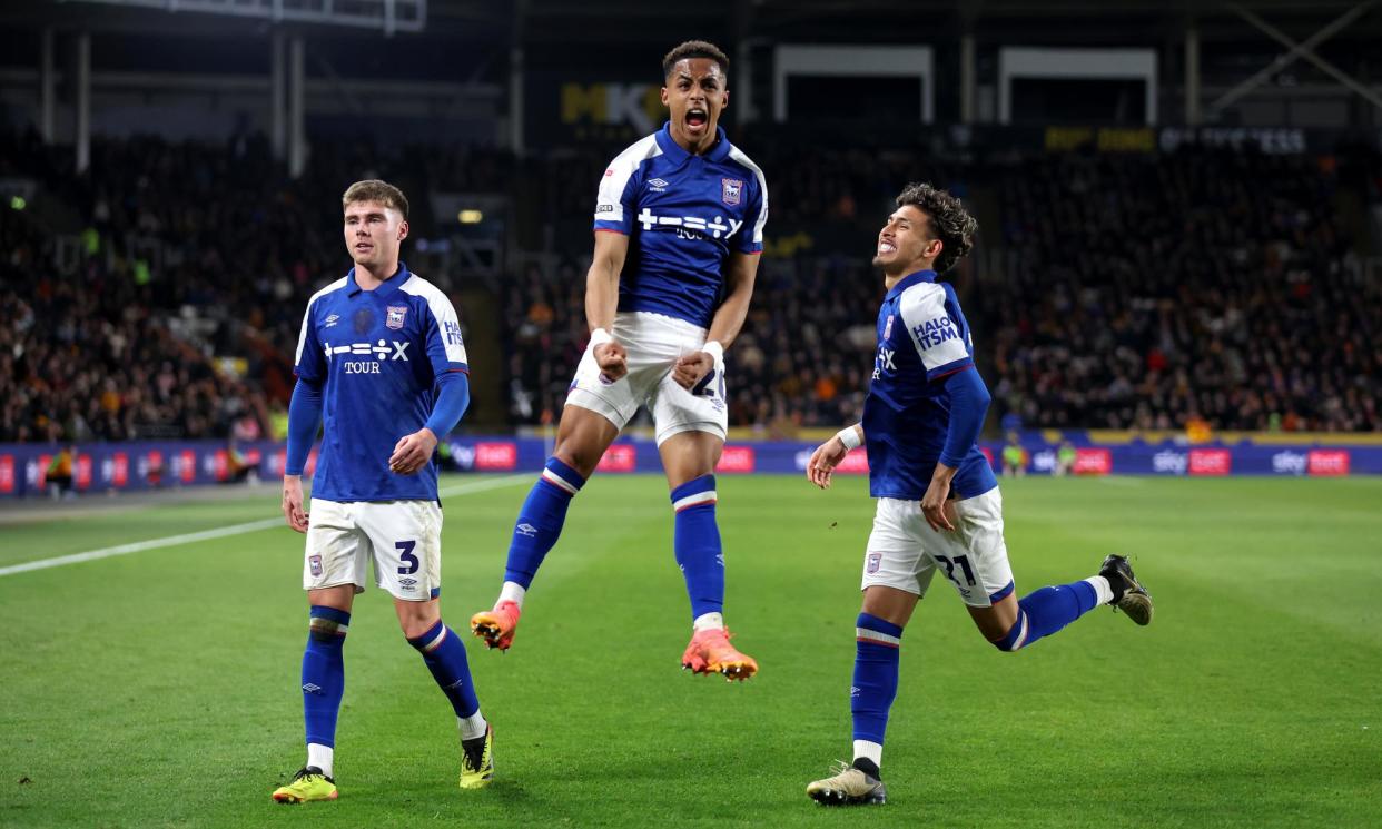 <span>Omari Hutchinson (centre) celebrates after scoring one of 10 league goals he got on loan at Ipswich to help them win promotion.</span><span>Photograph: George Wood/Getty Images</span>