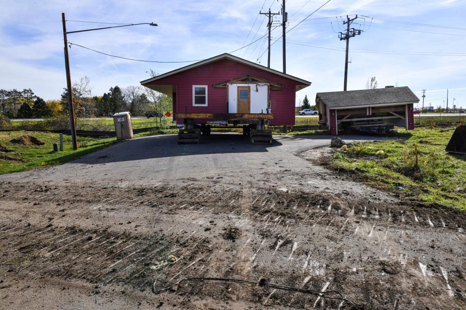 A home is ready to be moved from the former neighborhood along River Oaks Lane Tuesday, Oct. 26, 2021, in Sartell.