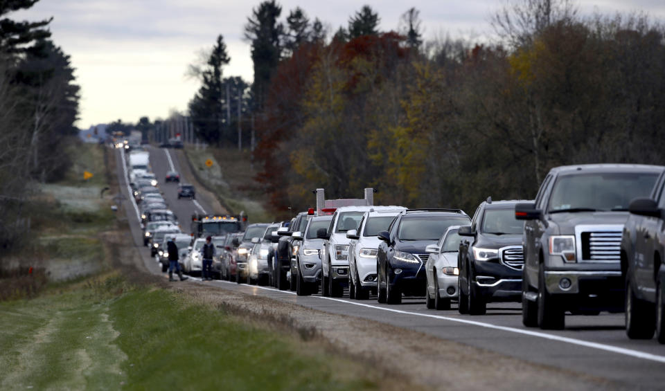 Volunteers line up along Highway 25 just north of Barron on Oct. 23, 2018, to assist in the search for Jayme Closs. (Photo: Associated Press)
