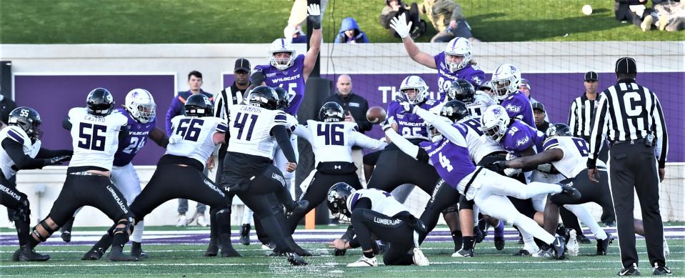 ACU's Anthony Egbo Jr. (4) blocks Chris Campos' 21-yard field goal attempt to preserve the Wildcats' 21-13 advantage with 1:57 left in the third quarter. The Lumberjacks beat ACU 24-21 for the Western Athletic Conference title Saturday, Nov. 19, 2022, at Wildcat Stadium.
