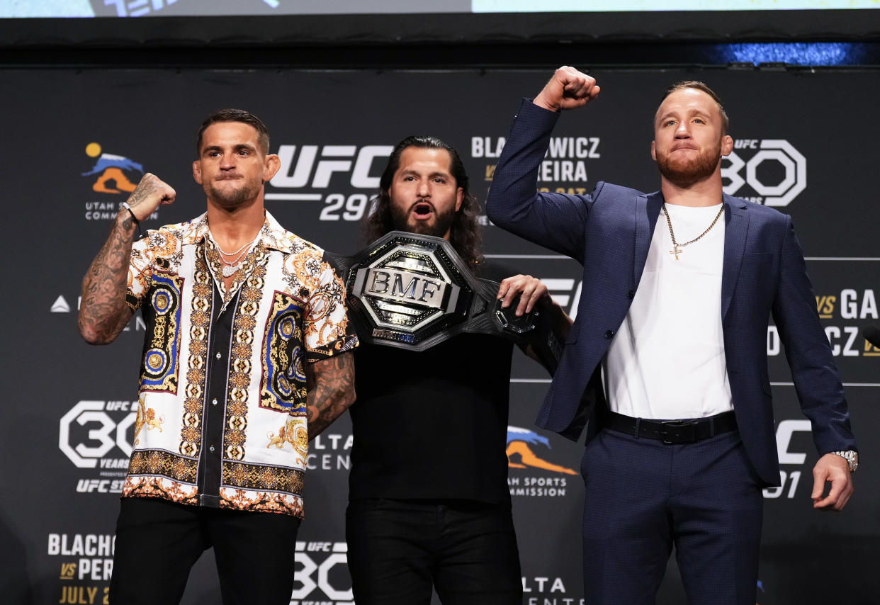 SALT LAKE CITY, UTAH - JULY 27: (L-R) Opponents Dustin Poirier and Justin Gaethje pose as inaugural BMF champ Jorge Masvidal holds the belt during the UFC 291 press conference at Salt Palace Convention Center on July 27, 2023 in Salt Lake City, Utah. (Photo by Jeff Bottari/Zuffa LLC via Getty Images)