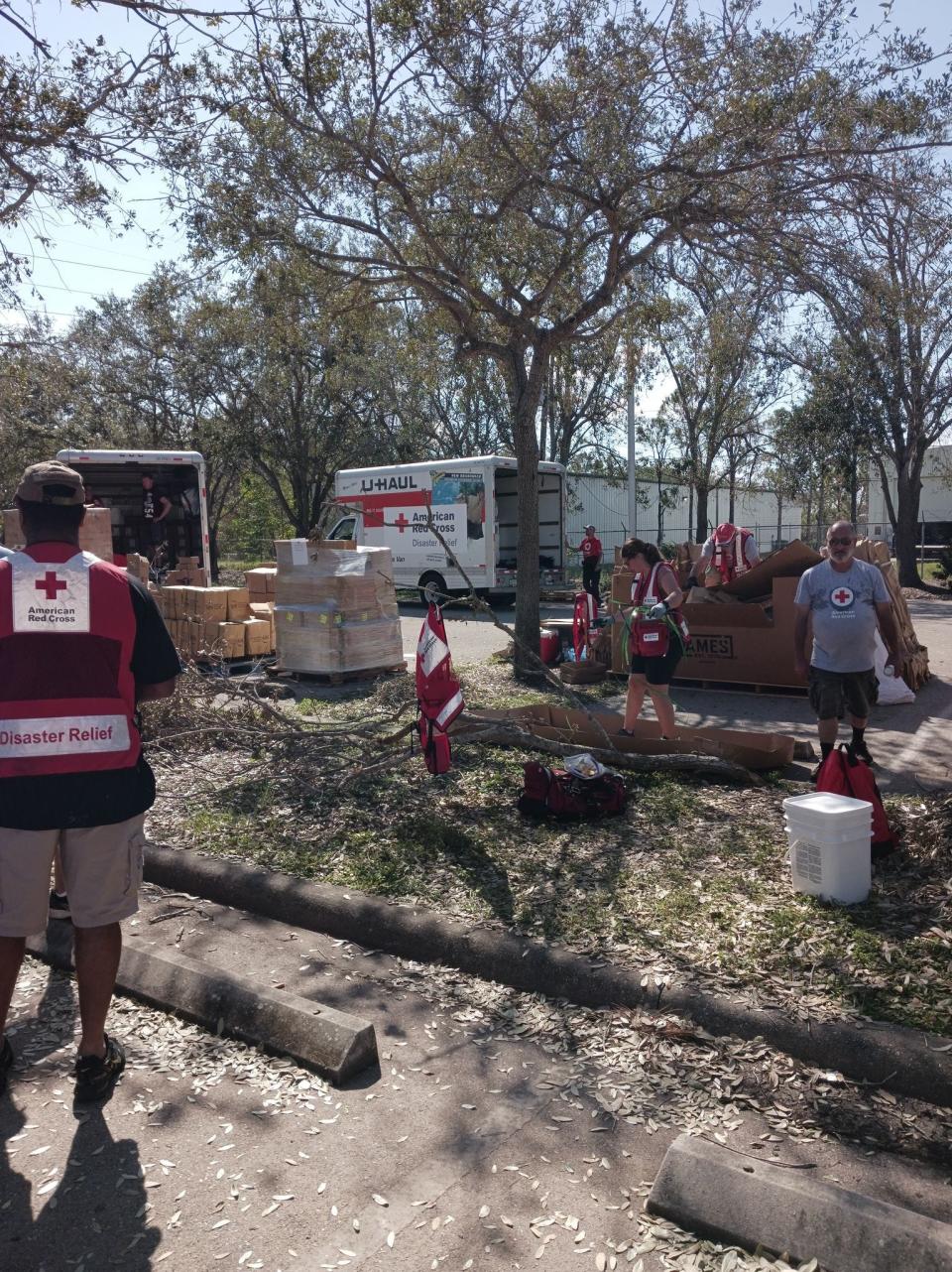 Red Cross volunteers are seen at a FEMA camp in Fort Myers, Fla. preparing supplies to be loaded into moving trucks and brought to places where they are needed. New Bedford resident Anthony Lessa Jr. has been working in the logistics section of the operation since he arrived in Florida on Oct. 1.