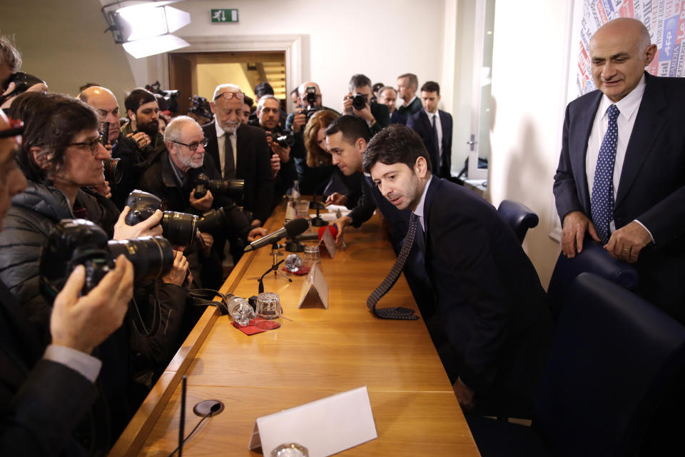 From left Italian Foreign Minister Luigi di Maio, Italy's Minister of Health Roberto Speranza, and Spallanzani Hospital Scientist Director Giuseppe Ippolito, arrive for a press conference at the foreign press association in Rome, Thursday, Feb. 27, 2020. The government is seeking to calm fears about the outbreak, which has seen countries issue travel advisories warning their citizens to avoid visiting hard-hit Lombardy and Veneto regions, which have seen the most cases. (AP Photo/Alessandra Tarantino)