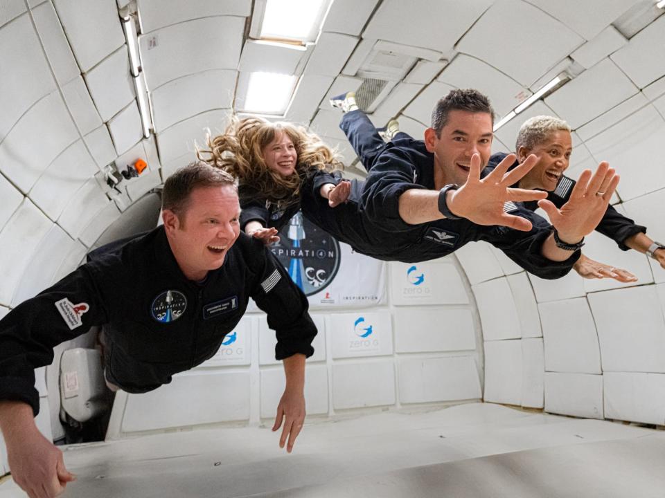 inspiration4 crew members screaming joy floating weightless inside plane