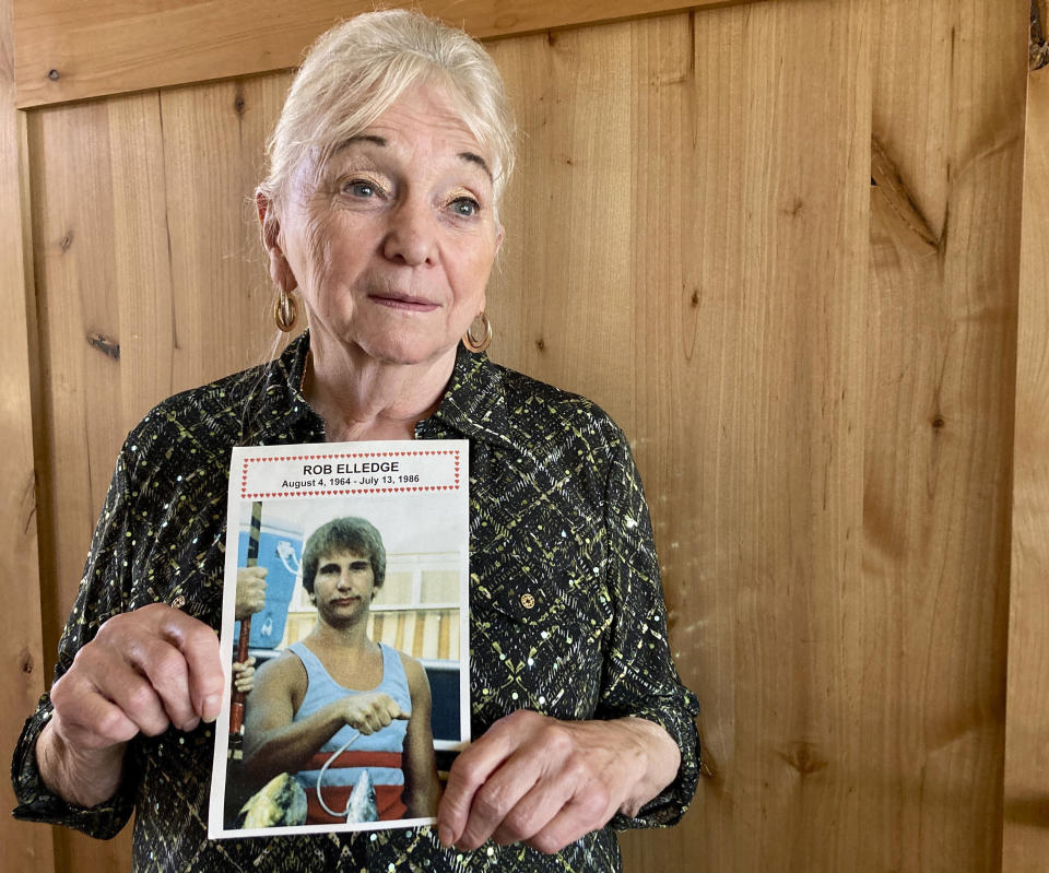 Mary Elledge holds a photograph of a picture taken in Oregon City, Ore., of her only son, Rob Elledge, on Oct. 27, 2022, who was murdered in 1986. Elledge, president of the Portland chapter of Parents of Murdered Children, is a registered Democrat but this November she will vote for the independent candidate for Oregon governor because she feels Democrats are too progressive on issues like bail and sentencing reform and early release. (AP Photo/Gillian Flaccus)