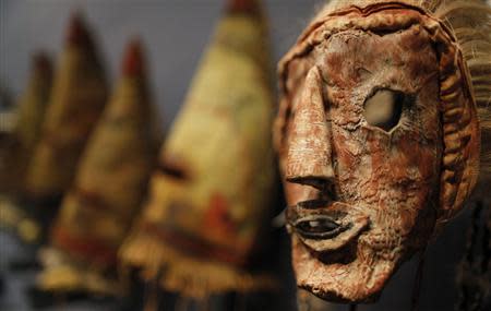 A rare antique tribal mask, Kachina Hapota, circa 1910-1920, revered as a sacred ritual artifact by the Native American Hopi tribe in Arizona is displayed at the Drouot auction house in Paris before auction, December 9, 2013. REUTERS/Christian Hartmann