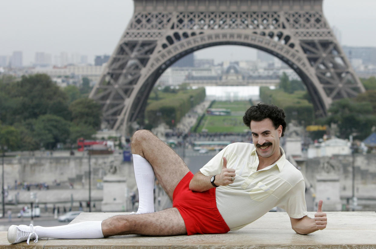 ** FILE ** British actor Sacha Baron Cohen, dressed in his character "Borat" poses for the press near the Eiffel tower in Paris, in this, Oct. 9, 2006, file photo. Cohen tells The Daily Telegraph that he's retiring the clueless Kazakh journalist, as well as his alter ego, aspiring rapper Ali G.  "When I was being Ali G and Borat I was in character sometimes 14 hours a day and I came to love them, so admitting I am never going to play them again is quite a sad thing," the 36-year-old actor-comedian says in the British newspaper's edition on Friday, Dec. 21, 2007.  (AP Photo/Christophe Ena, file)