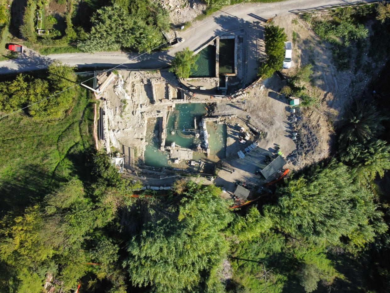 Archaeologists work at the site of the discovery of two dozen well-preserved bronze statues from an ancient Tuscan thermal spring in San Casciano dei Bagni, central Italy, in this update photo made available by the Italian Culture Ministry, Friday, Sept. 23, 2022. (Italian Culture Ministry via AP)