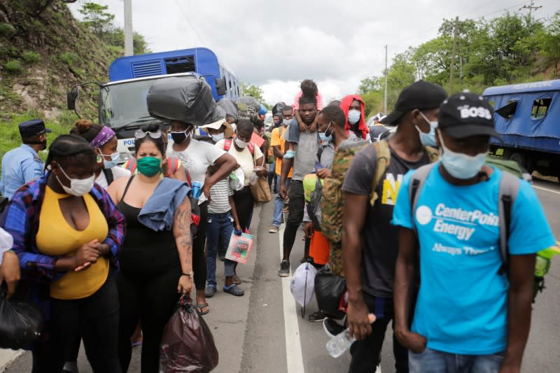 African, Cuban and Haitian migrants, which are stranded in Honduras after borders were closed due to the coronavirus disease (COVID-19) outbreak, trek northward in an attempt to reach the United States, in Choluteca