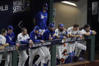 Members of the Los Angeles Dodgers watch during the ninth inning in Game 2 of the baseball World Series against the Tampa Bay Rays Wednesday, Oct. 21, 2020, in Arlington, Texas. (AP Photo/Sue Ogrocki)