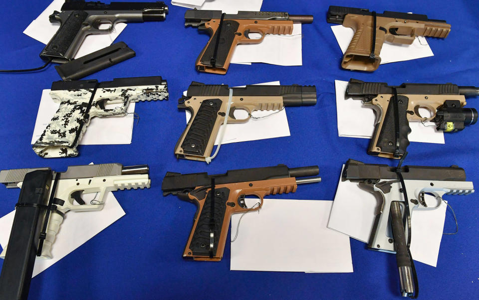 Seized ghost guns are displayed on a table. (Robyn Beck / AFP via Getty Images file)