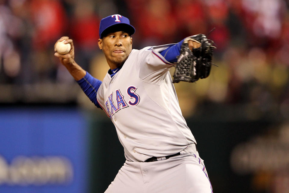 ST LOUIS, MO - OCTOBER 20: Alexi Ogando #41 of the Texas Rangers pitches in the seventh inning during Game Two of the MLB World Series against the St. Louis Cardinals at Busch Stadium on October 20, 2011 in St Louis, Missouri. (Photo by Jamie Squire/Getty Images)