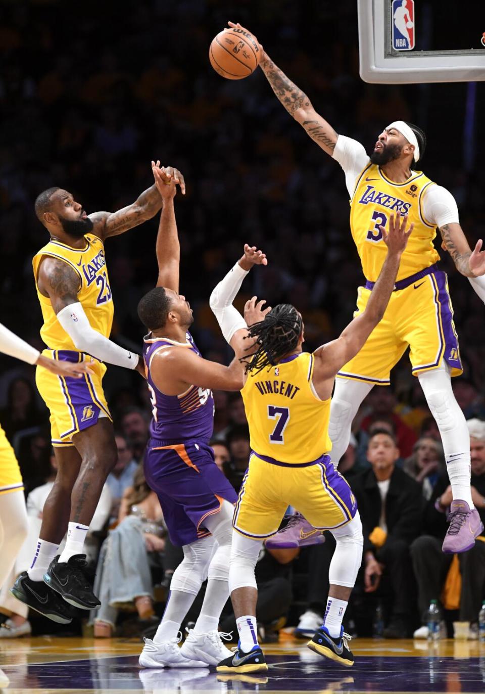 Lakers forward Anthony Davis blocks the shot by Phoenix Suns guard Eric Gordon in the fourth quarter.