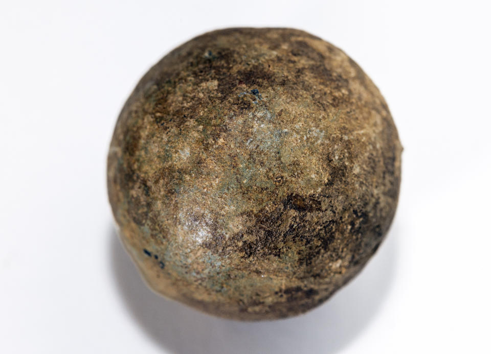This image provided by Colonial Williamsburg Foundation, shows a lead musket ball was excavated in the summer of 2023 by archaeologists at Colonial Williamsburg, a living history museum in Virginia. The ball was found at the site of what was believed to be a military barracks during the American Revolution. The museum announced the site’s discovery on Tuesday, May 14, 2024. (Brendan Sostak/Colonial Williamsburg Foundation via AP)