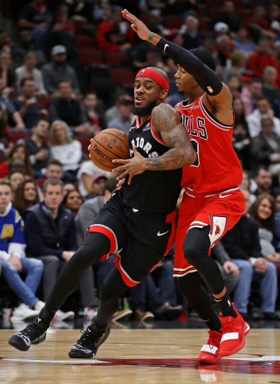 Toronto's Lorenzo Brown drives against Shaquille Harrison in a Raptors' win over the Bulls in Chicago