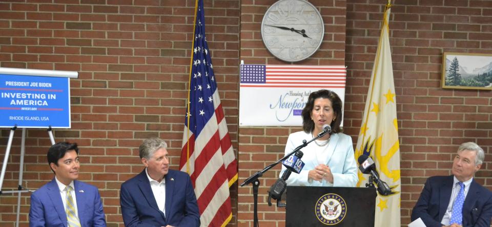 Newport Mayor Xay Khamsyvoravong, RI Governor Dan McKee and US Senator Sheldon Whitehouse watch US Secretary of Commerce Gina Raimondo deliver remarks about federal BEAD funding for internet at DOnovan Manor in Newport, RI on June 30, 2023.