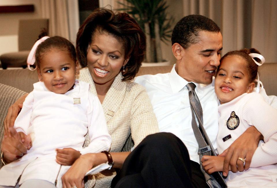 CHICAGO - NOVEMBER 2: Candidate for the U.S. Senate Barack Obama (D-IL) sits with his wife Michelle and daughters Sasha (L) and Malia (R) in a hotel room as they wait for election returns to come in November 2, 2004 in Chicago, Illinois. Obama is expected to win easily against the Republican candidate Alan Keyes. (Photo by Scott Olson/Getty Images)