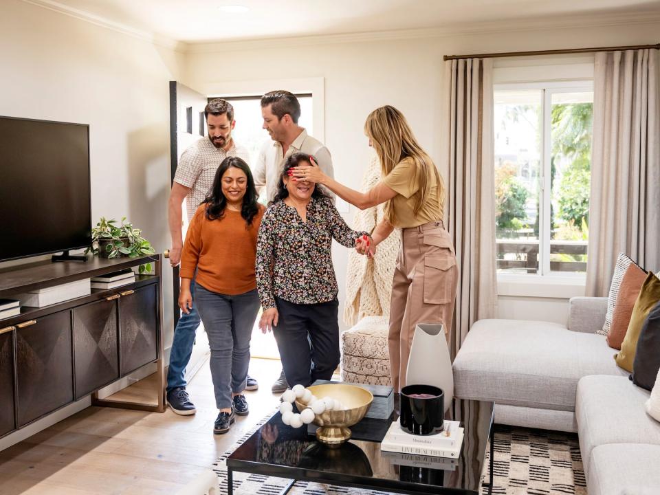 Heidi Klum and the Property Brothers surprise two people with a home renovation.