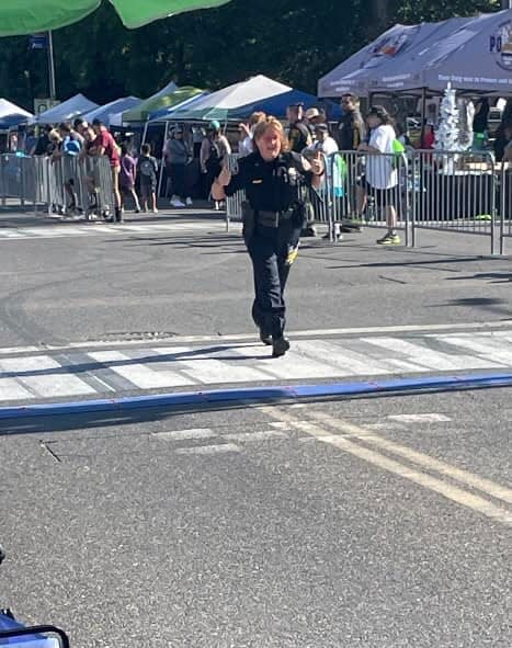 New Philadelphia police officer Jennifer Horner crosses the finish line at the Peace Officer Memorial Run in Modesto, California. She ran a half marathon in three hours, 18 minutes while wearing her full uniform, estimated at 15 to 25 pounds.