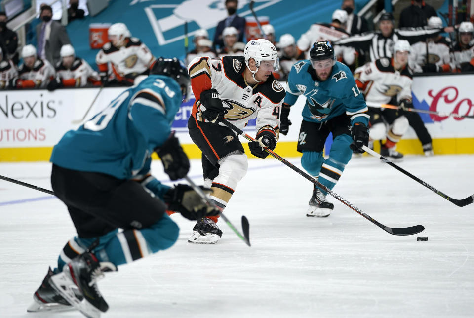 Anaheim Ducks defenseman Hampus Lindholm (47) skates past San Jose Sharks right wing Stefan Noesen (11) during the second period of an NHL hockey game in San Jose, Calif., Monday, Feb. 15, 2021. (AP Photo/Tony Avelar)