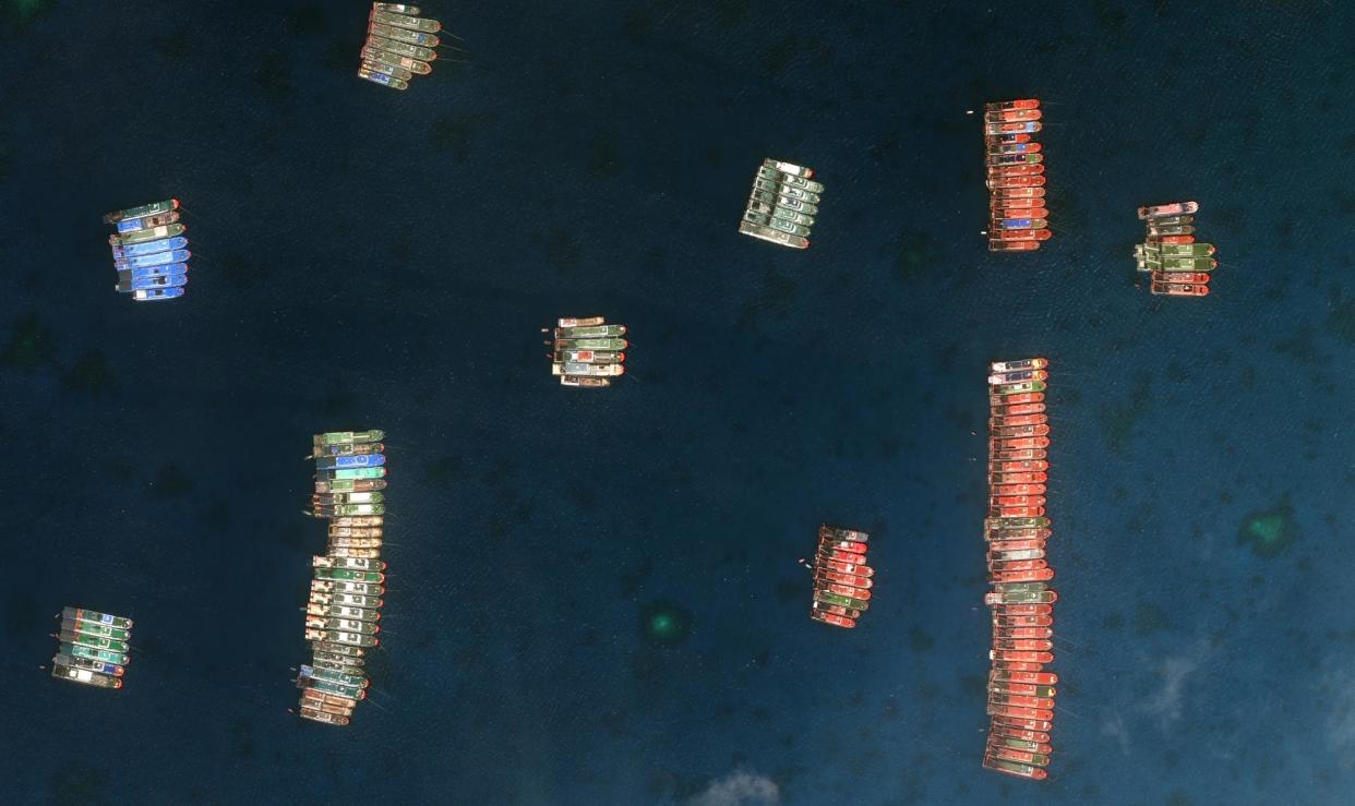 <span>A satellite image showing the rafting technique used by Chinese vessels in the South China Sea in 2021. China’s maritime militia has proved useful to Beijing to hold disputed territory in the region.</span><span>Photograph: Maxar Technologies Handout/EPA</span>