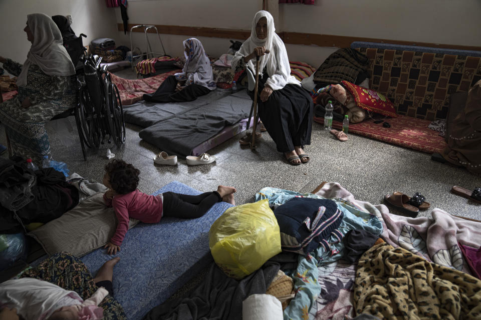 Palestinians take shelter from the Israeli bombardment at a school in Khan Younis in the Gaza Strip on Monday, Oct.16, 2023. (AP Photo/Fatima Shbair)