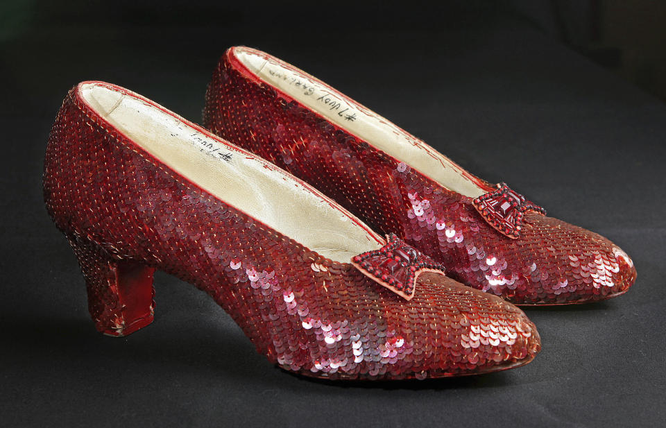 FILE - Sequin-covered ruby slippers worn by Judy Garland in "The Wizard of Oz" appear at the offices of Profiles in History in Calabasas, Calif. on Nov. 9, 2001. A dying thief who confessed to stealing the slippers because he wanted to pull off “one last score,” was given no prison time at his sentencing hearing Monday, Jan 29, 2024. The thief, Terry Jon Martin, said he had planned to remove what he thought were real rubies from the shoes and sell them. Once he learned the shoes were adorned only with sequins and glass beads, he got rid of them. (AP Photo/Reed Saxon, File)