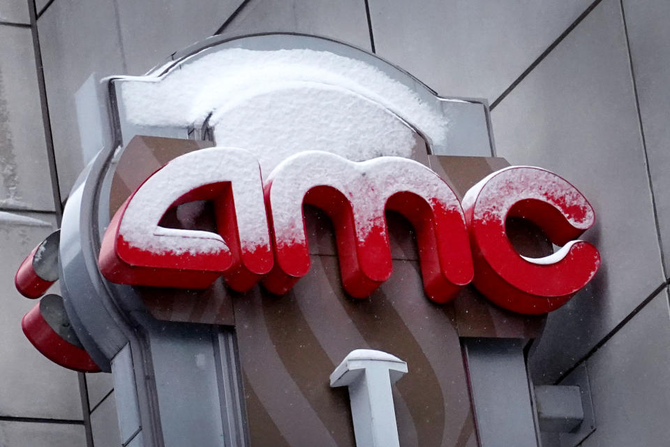 CHICAGO, ILLINOIS - JANUARY 27: A sign hangs in front of an AMC theater on January 27, 2021 in Chicago, Illinois. Shares of AMC Entertainment more than quadrupled today as investors continue their buying spree on heavily shorted stocks. (Photo by Scott Olson/Getty Images)