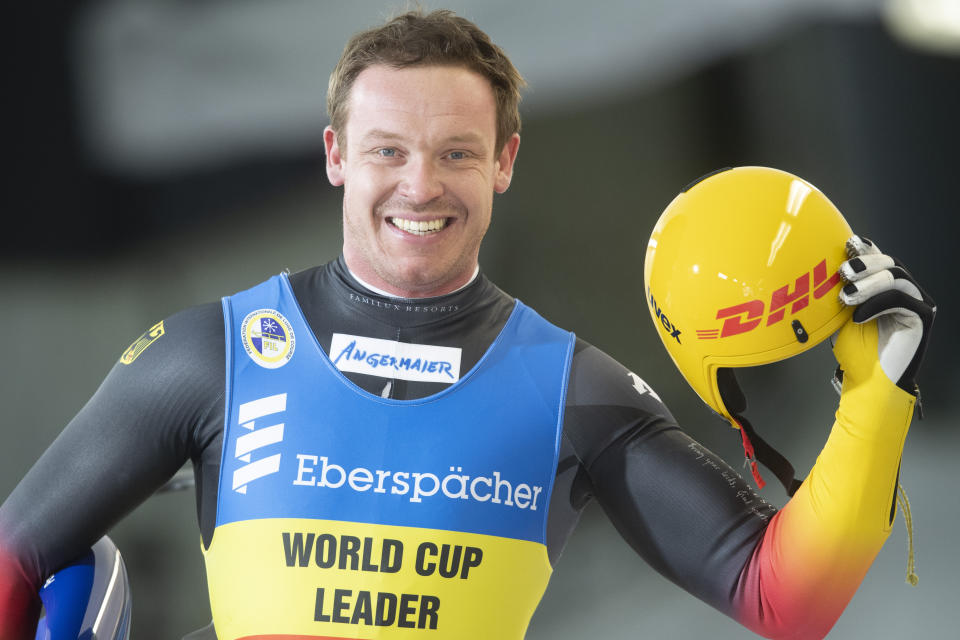 Felix Loch of Germany celebrates after his 2nd run during the Luge World Cup event in Innsbruck, Austria, Saturday, Jan. 23, 2021. (AP Photo/Andreas Schaad)