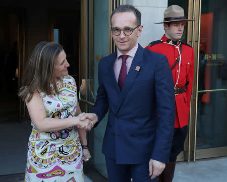 Canada's Minister of Foreign Affairs Chrystia Freeland shakes hands with Minister of Foreign Affairs for Germany Heiko Maas prior to a reception at the Royal Ontario Museum on the first day of of meetings for foreign ministers from G7 countries in Toronto, Ontario, Canada April 22, 2018. REUTERS/Fred Thornhill