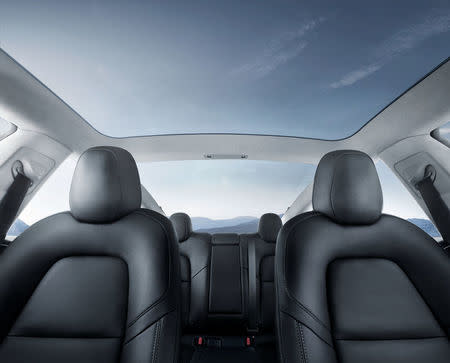 The interior of the Tesla Model 3 sedan is seen in this undated handout image as the car company handed over its first 30 Model 3 vehicles to employee buyers at the company’s Fremont facility in California, U.S. on July 28, 2017. Tesla/Handout via REUTERS