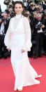 <p>The French actress walked the red carpet at the <em>Okja</em> premiere in a white gown with bell sleeves, halter detailing, and a turtleneck. </p>