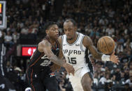 Detroit Pistons guard Marcus Sasser (25) defends against San Antonio Spurs guard Jamaree Bouyea (15) during the first half of an NBA basketball game, Sunday, April 14, 2024, in San Antonio, Texas. (AP Photo/Michael Thomas)