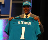 NEW YORK, NY - APRIL 26: Justin Blackmon from Oklahoma State holds up a jersey as he stands on stage after he was selected #5 overall by the Jacksonville Jaguars in the first round of the 2012 NFL Draft at Radio City Music Hall on April 26, 2012 in New York City. (Photo by Al Bello/Getty Images)