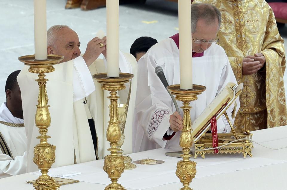 Pope Francis holds the holy host as he celebrates Easter Mass in St. Peter's Square at the Vatican, Sunday, April 21, 2019. (AP Photo/Andrew Medichini)