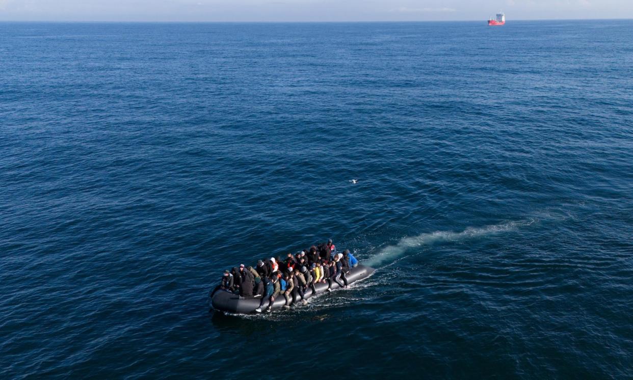 <span>People crossing the Channel in a small boat last month.</span><span>Photograph: Tolga Akmen/EPA</span>