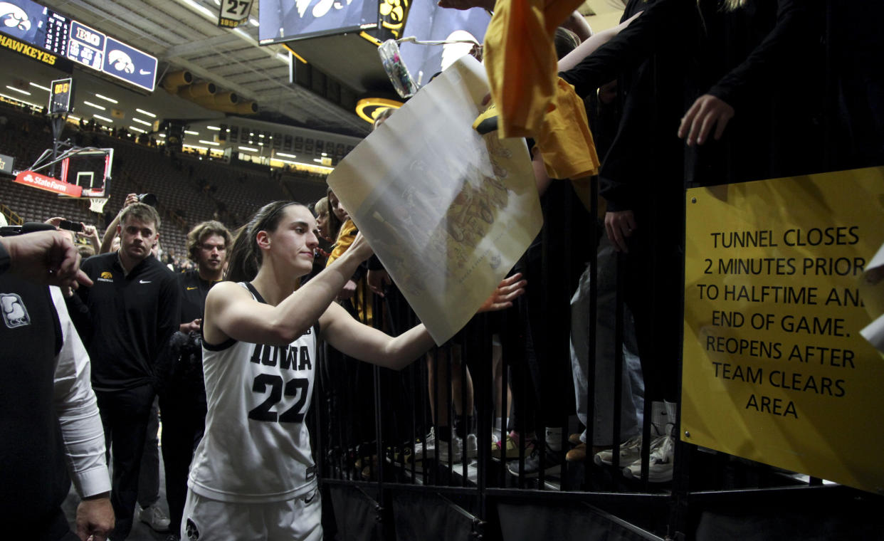 Iowa guard Caitlin Clark interacts with fans after a game at Carver-Hawkeye Arena in Iowa City, Iowa, on Nov. 19, 2023. (Photo by Matthew Holst/Getty Images)